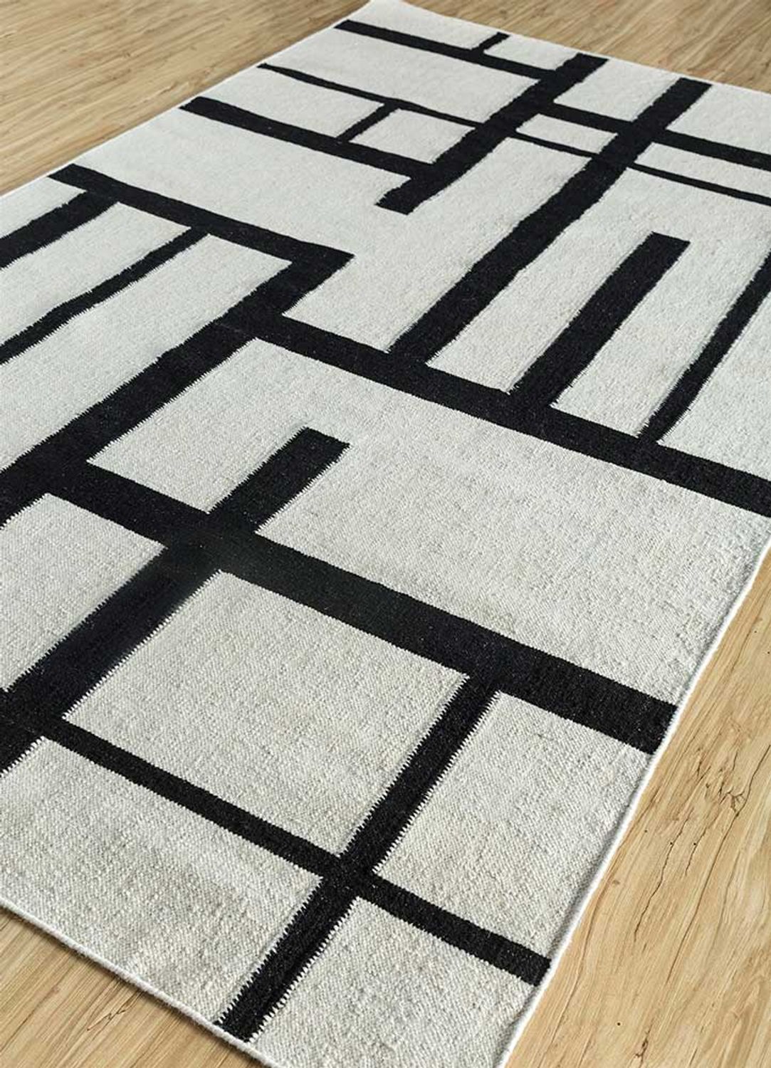 Wollteppich - 240 x 150 cm - schwarz-weiß
